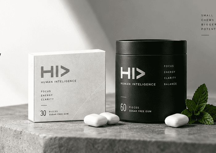 HI> nootropic gum — Clean Mint box and Spearmint tin on a stone ledge